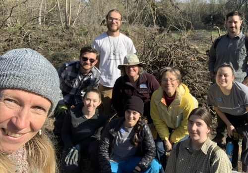 Students and faculty group shot in garden