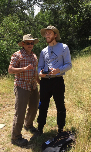 Student and Dr. Clark steering a drone